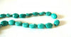 1 perle ovale en howlite couleur vert turquoise